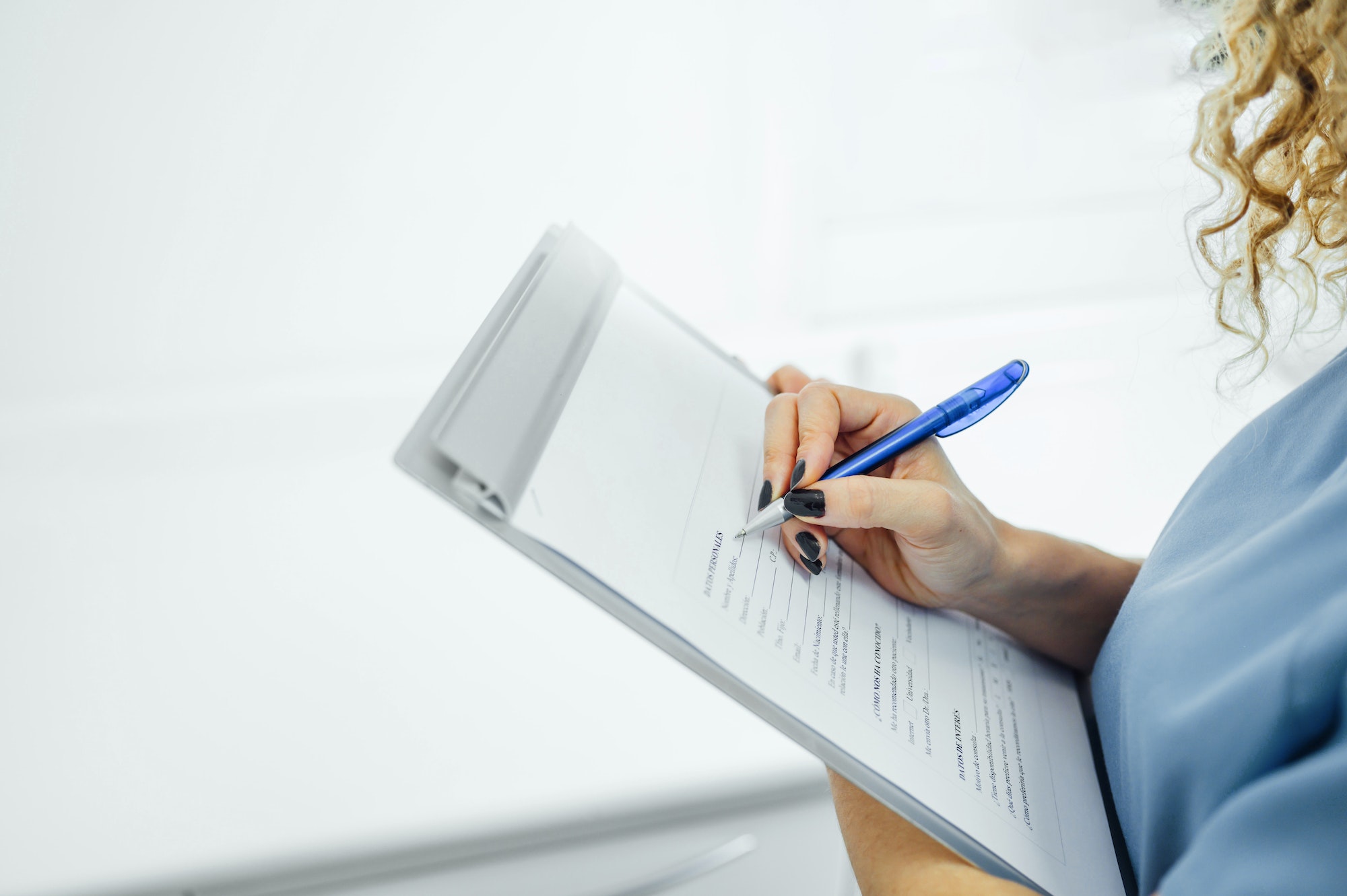 Woman filling a patient form